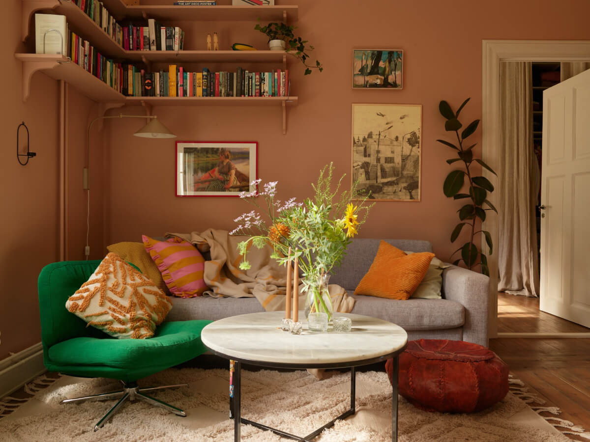 A Nature-Inspired Color Palette in a Stockholm Apartment 3 sitting room corner bookshelves
