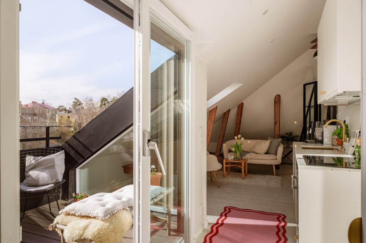 A Bright Attic Apartment with Exposed Beams and a Roof Terrace 9 small attic apartment roof terrace