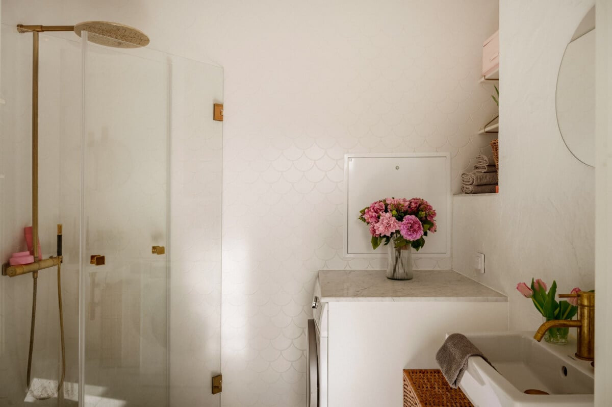 A Bright Attic Apartment with Exposed Beams and a Roof Terrace 21 small bathroom brass fittings