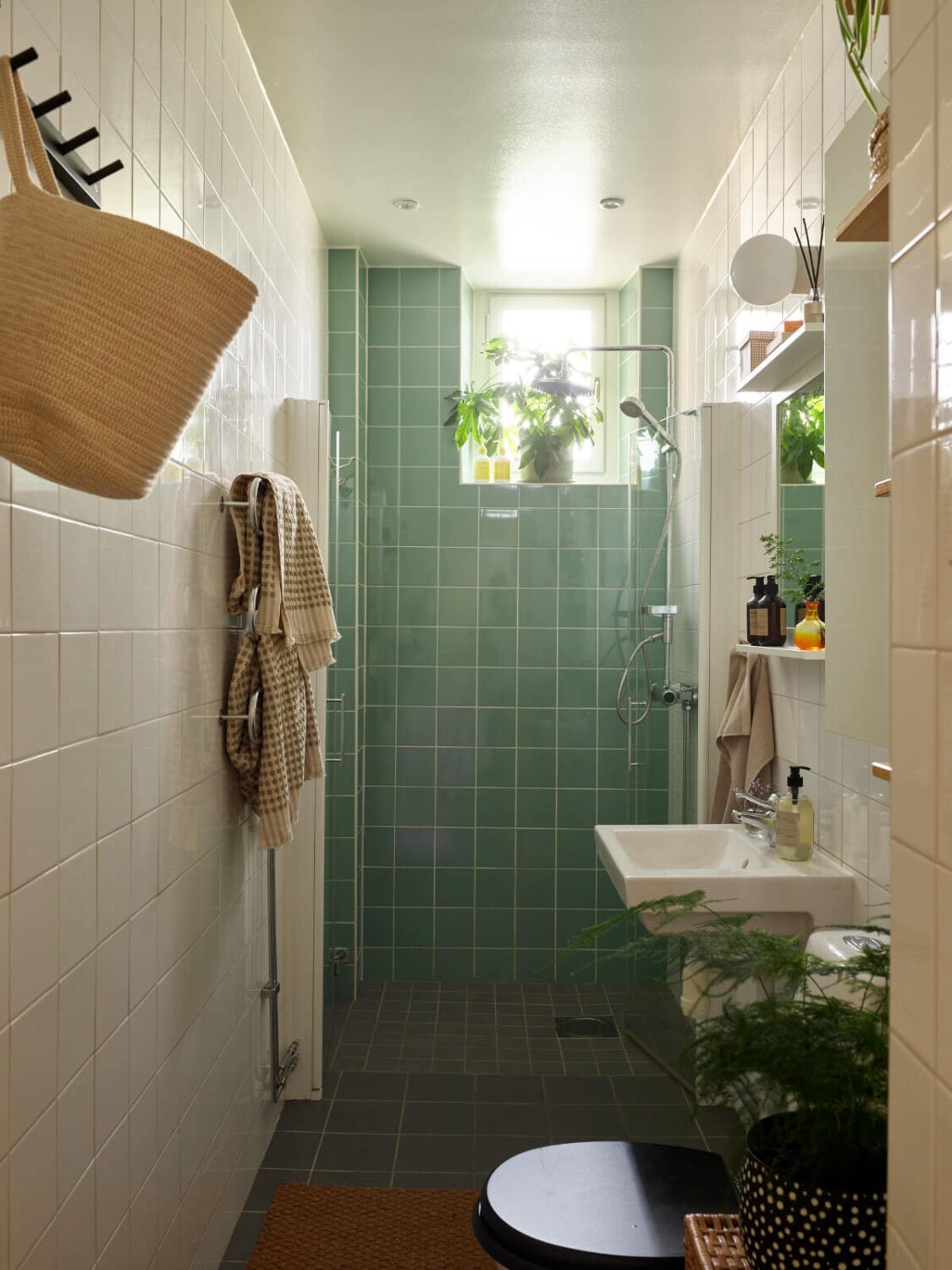 A Nature-Inspired Color Palette in a Stockholm Apartment 23 small bathroom green tiles