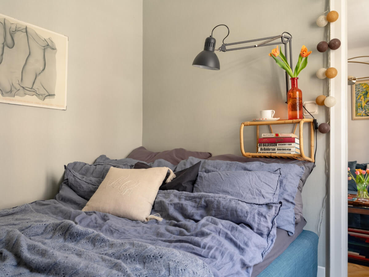 A Small, Cozy Apartment with Built-in Storage and Bookshelves 16 small bedroom rattan bedside shelf