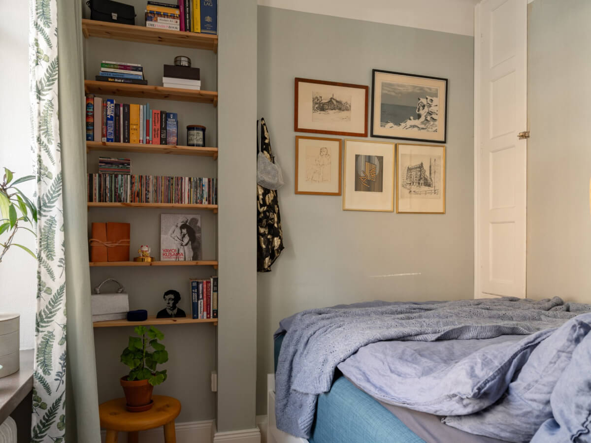 A Small, Cozy Apartment with Built-in Storage and Bookshelves 15 small bedroom wooden shelves in niche