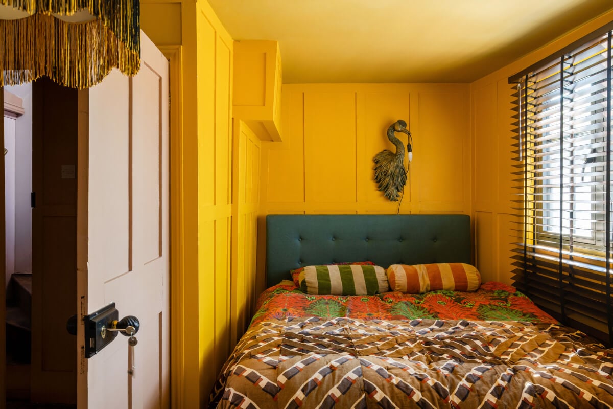 Colorful Design and Historic Features in a Charming English Home 11 small bright yellow bedroom nordroom