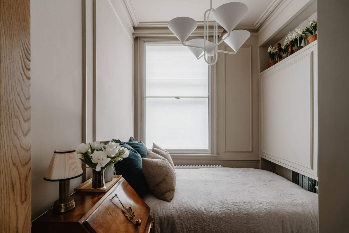 A Classy Apartment on the Top Floors of a 19th-Century Building 11 small classic bedroom