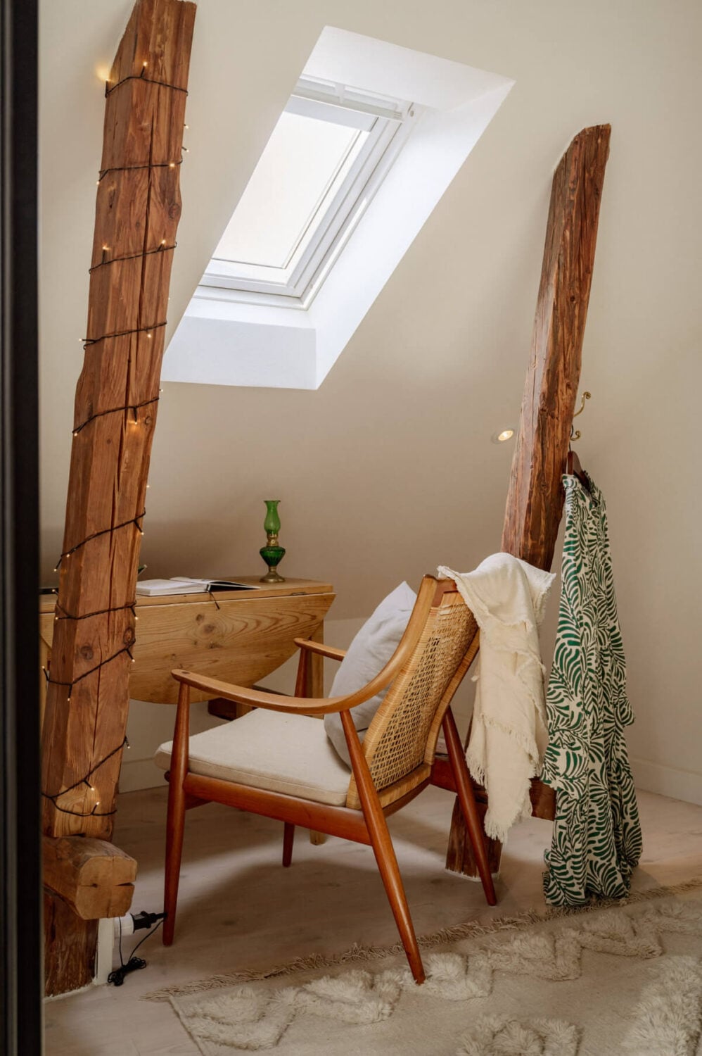 A Bright Attic Apartment with Exposed Beams and a Roof Terrace 17 small desk under slanted ceiling exposed beams