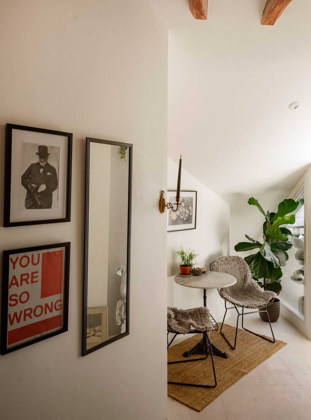 A Bright Attic Apartment with Exposed Beams and a Roof Terrace 19 small dining area