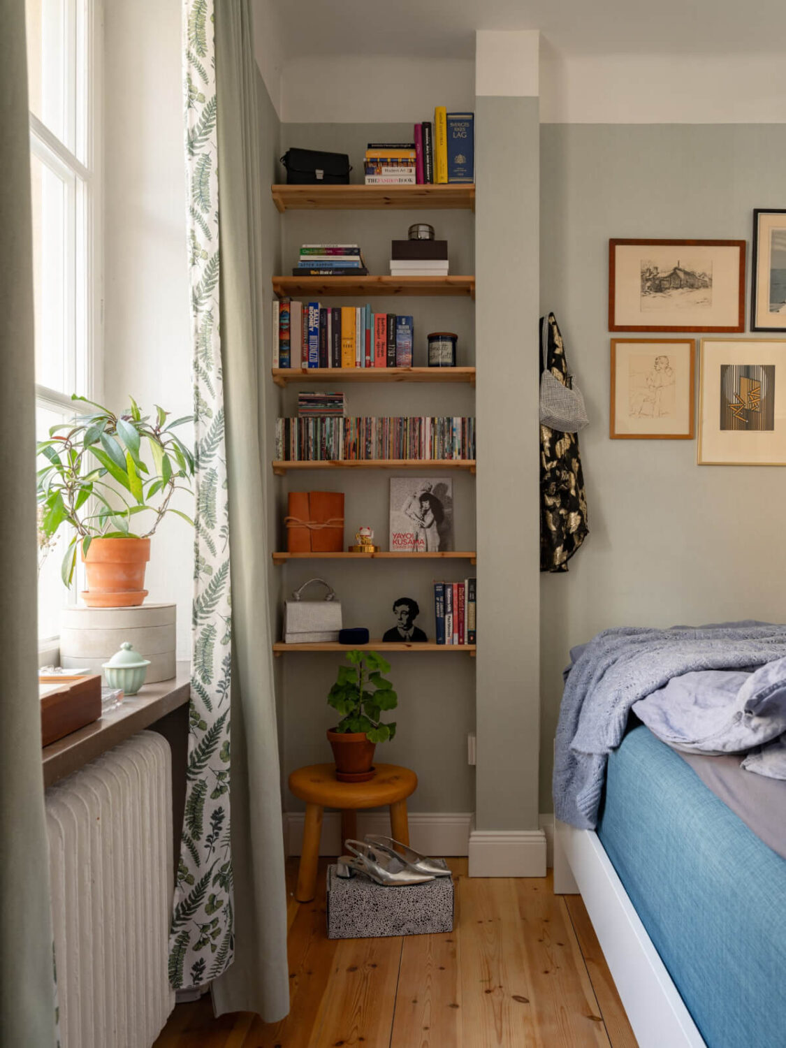A Small, Cozy Apartment with Built-in Storage and Bookshelves 14 small gray living room with niche fitted with shelves