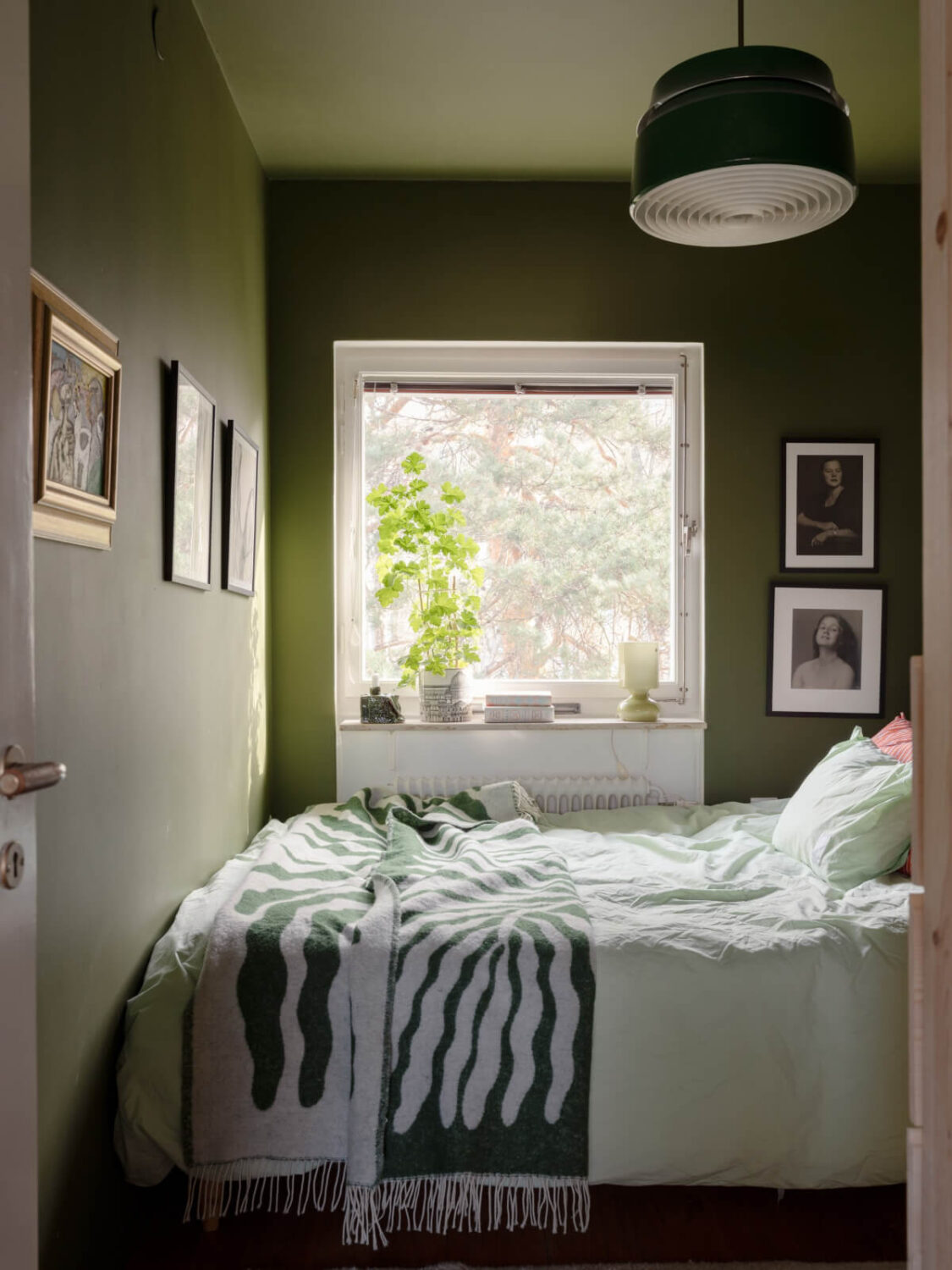 Color Accents in a Renovated Midcentury Apartment in Stockholm 17 small green bedroom