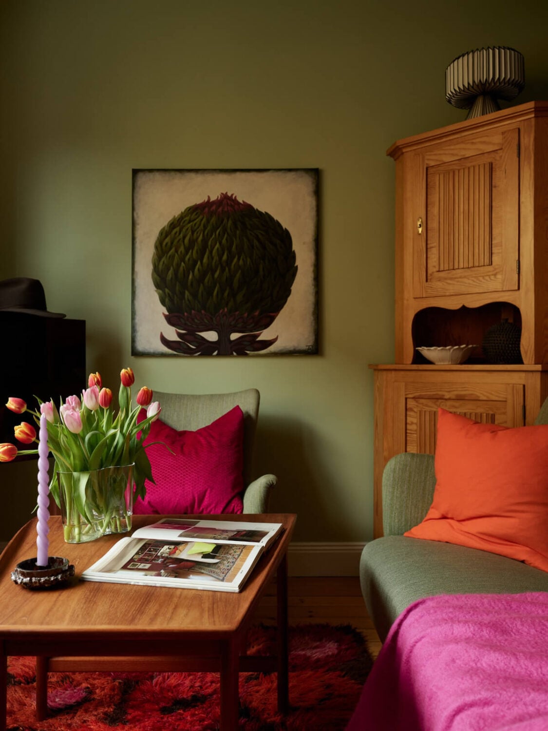 A Colorful Studio Apartment with Smart Storage and A Cozy Bed Niche 3 small green sitting area