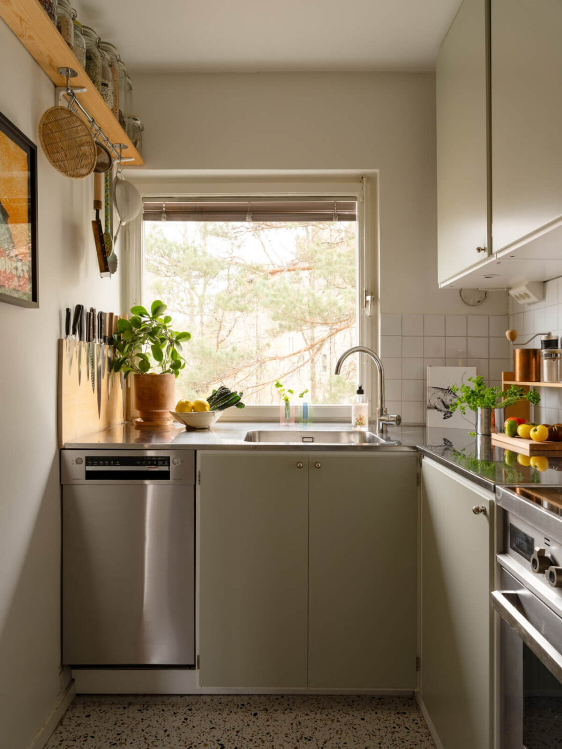 Color Accents in a Renovated Midcentury Apartment in Stockholm 14 small kitchen green cabinets