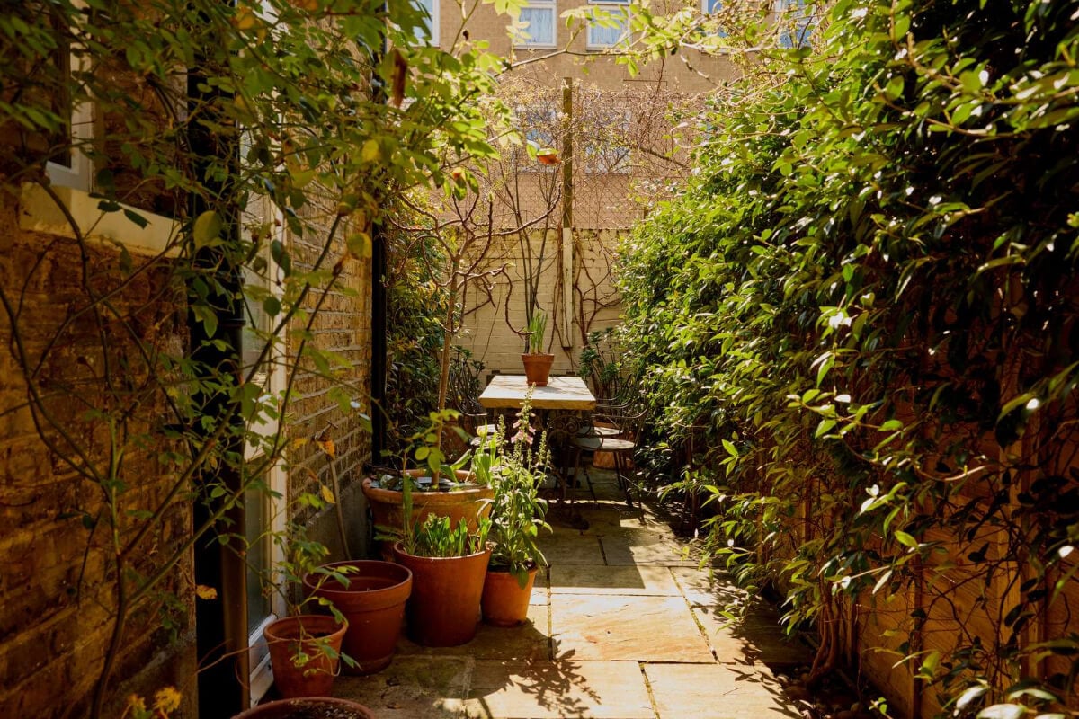 Bespoke Oak Cabinets and Plaster Walls in a London Garden Apartment 14 small paved garden greenery