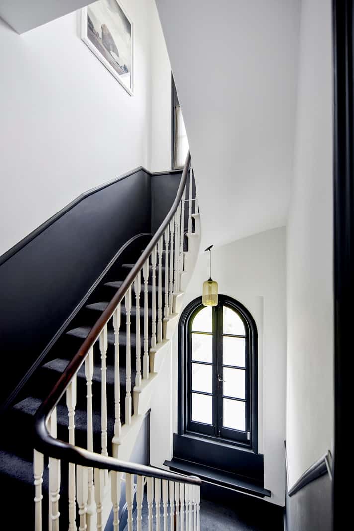 Light and Dark in a Spacious Victorian Townhouse in London 20 staircase arched window
