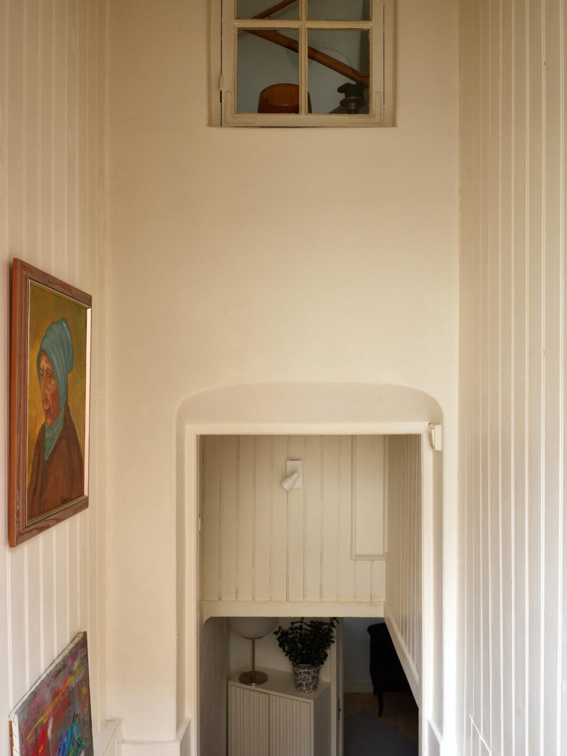 A Charming Semi-Detached House in the First Garden Town of Stockholm 27 staircase with art