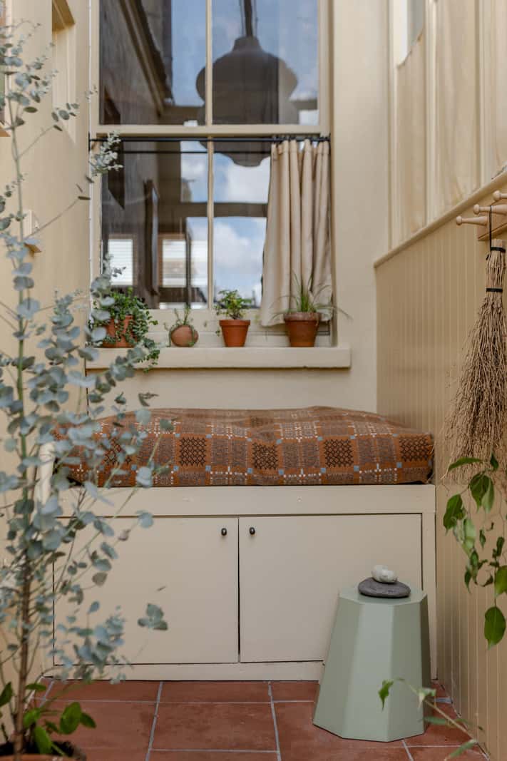 Reclaimed Materials and Custom Storage in a Serene London Home 24 storage bench tile floor