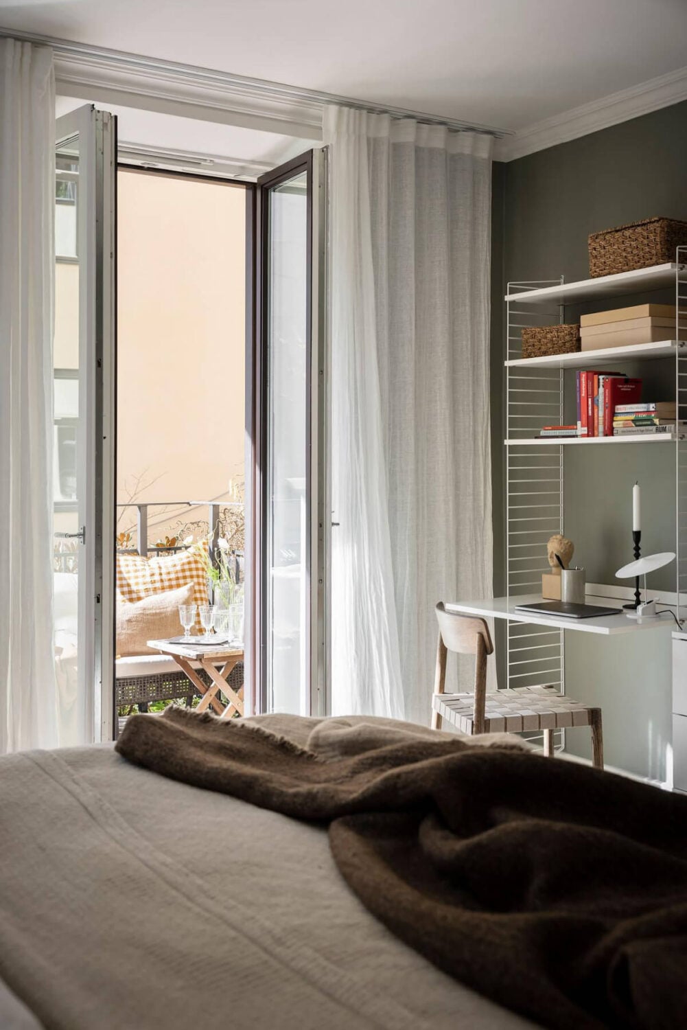 A Bright One-Bedroom Apartment with a Large Balcony 24 string shelves home office