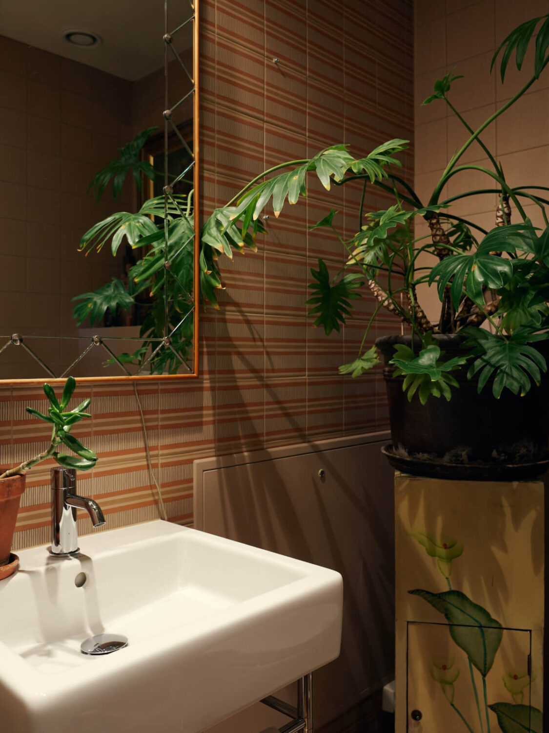 A Personal and Cozy 1960s Family Home in Sweden 22 striped tiles bathroom
