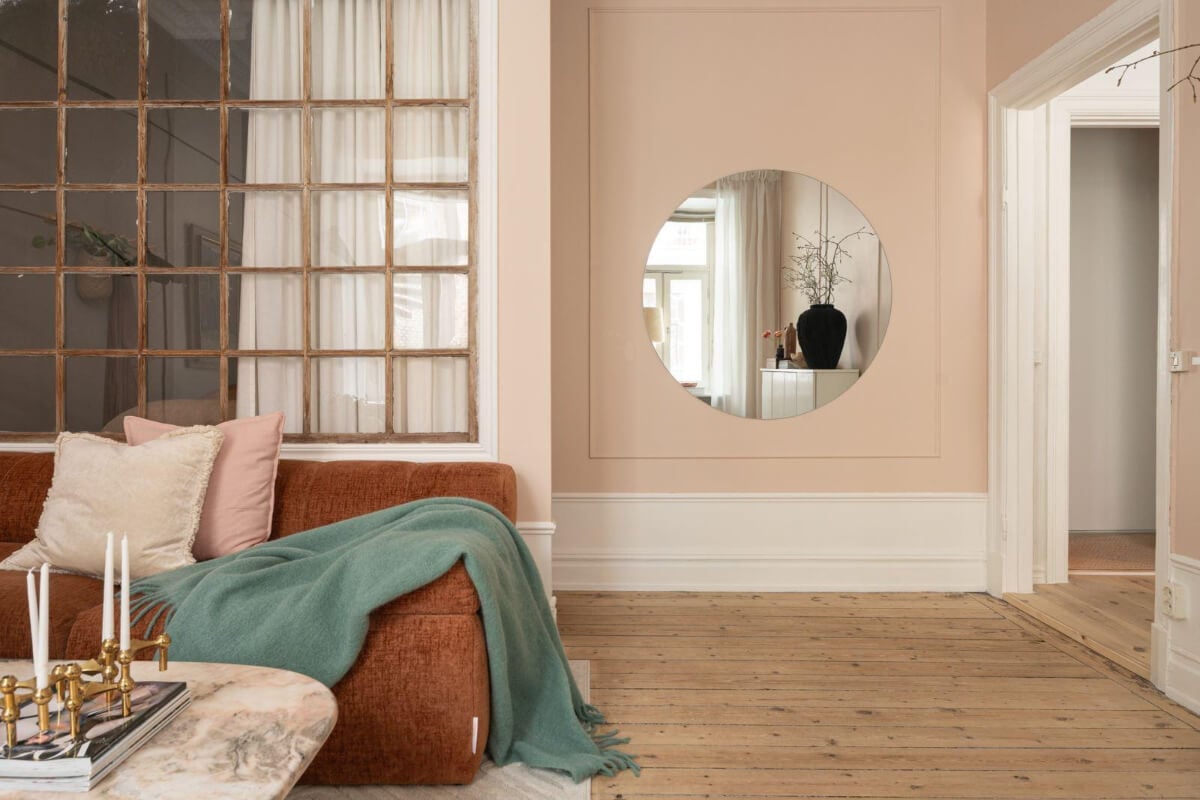 Warm Colors and Classic Elements in a Charming Studio Apartment 5 studio apartment pink walls large mirror wooden floor