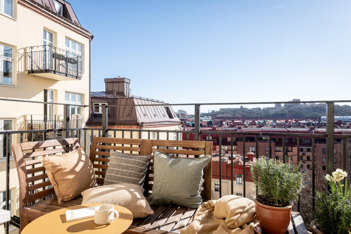 A Natural Color Palette, Period Features, & Grand Rooms in a Swedish Home 22 sunny balcony