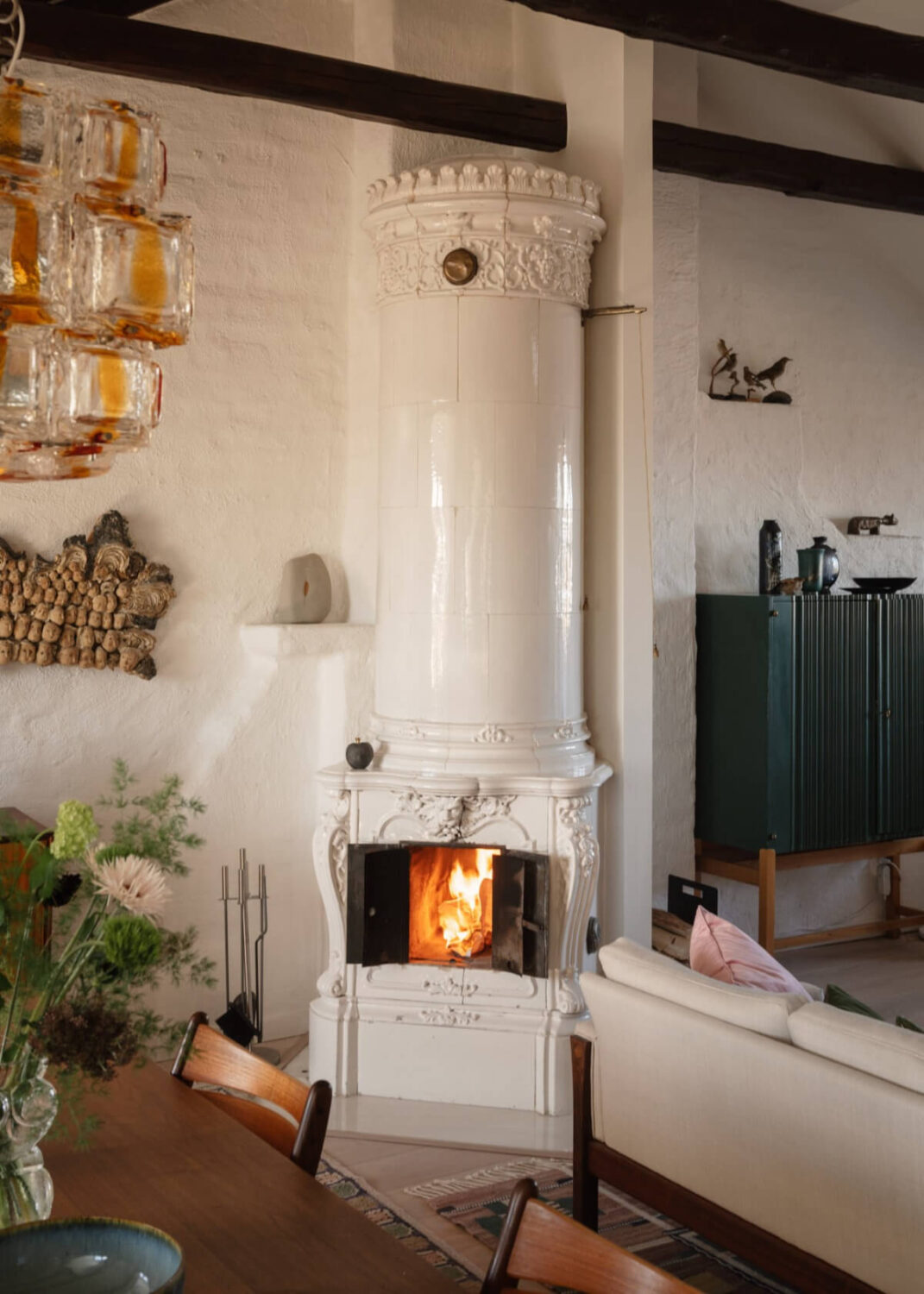 Revisiting a Spectacular Stockholm Penthouse with Exposed Beams 8 swedish fireplace