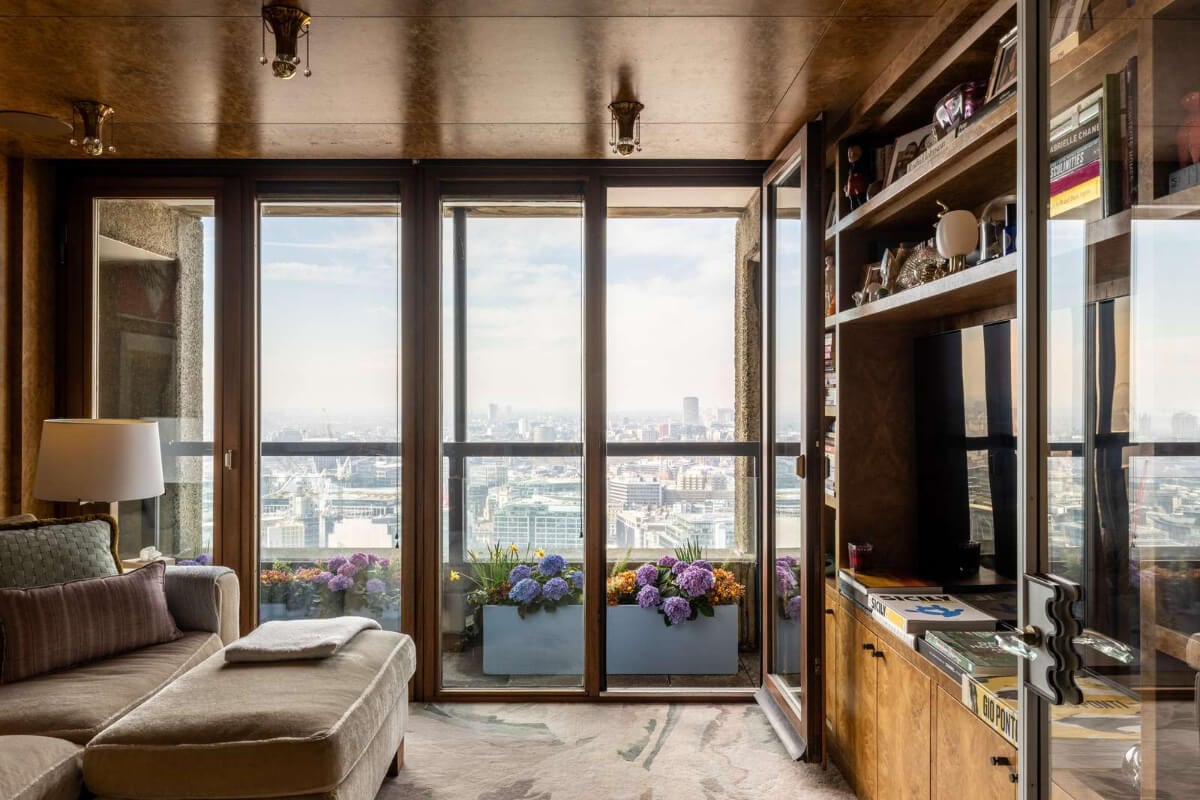 Oak and Marble in a Spectacular Brutalist Apartment in London 15 television room