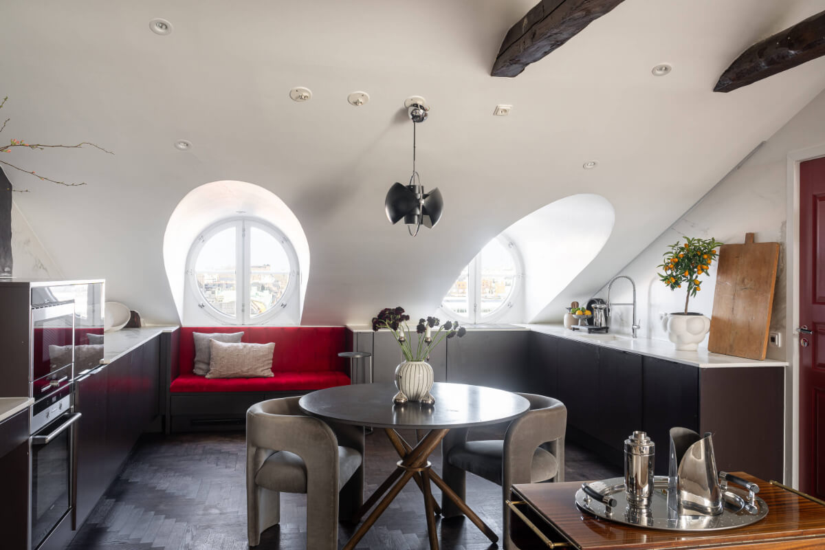 A Stylish Black and White Penthouse Apartment in Stockholm 8 u-shaped modern kitchen window seat round dining table