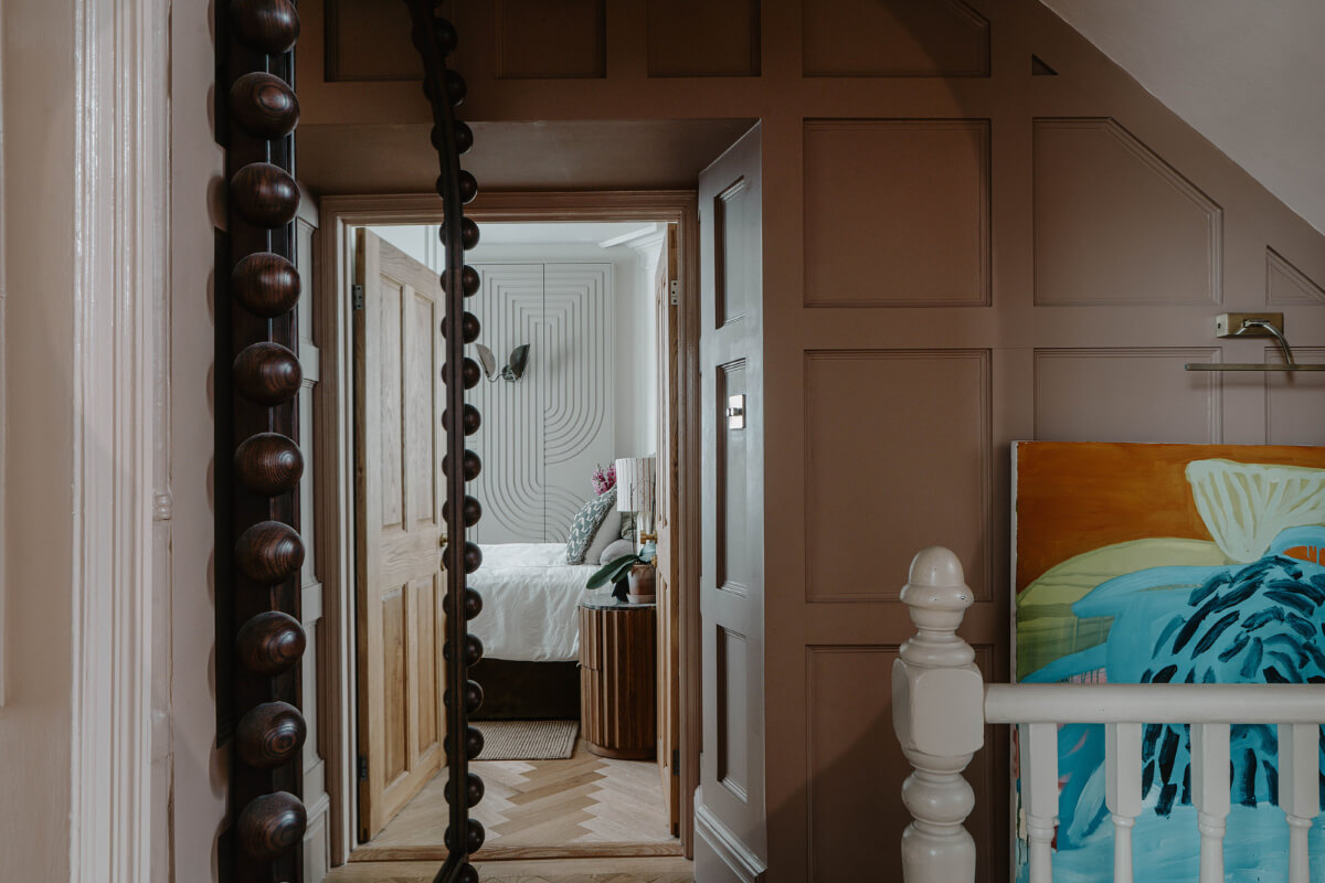 A Classy Apartment on the Top Floors of a 19th-Century Building 7 view into bedroom
