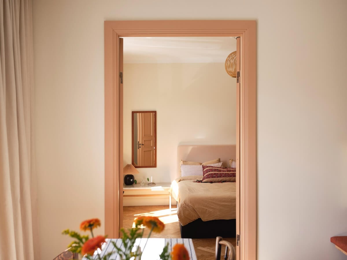 Warm, Natural Light in a Renovated Turn-of-the-Century Apartment 7 view into bedroom