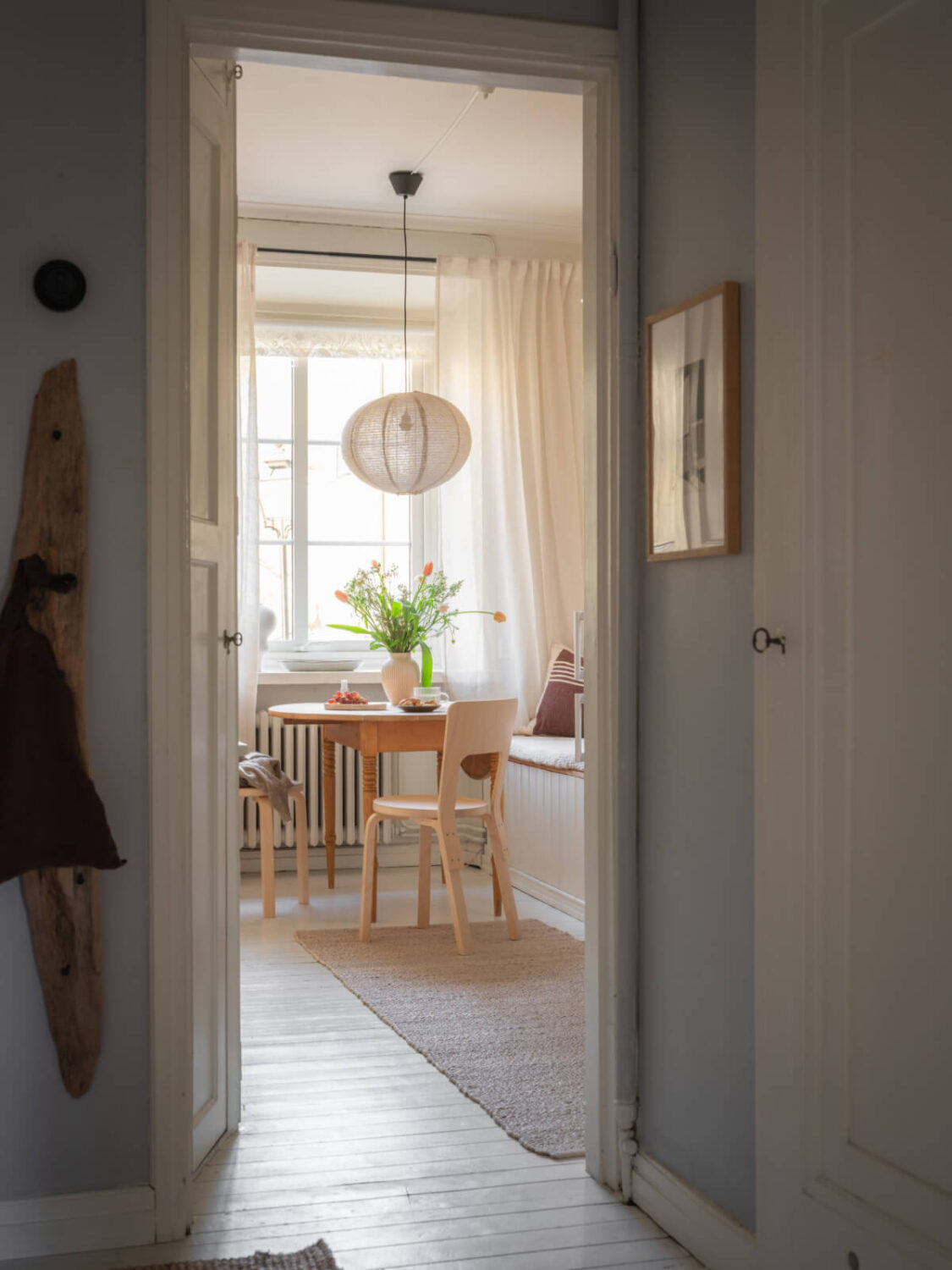 A Light-Colored Studio Apartment with a Cozy Kitchen 6 view into kitchen