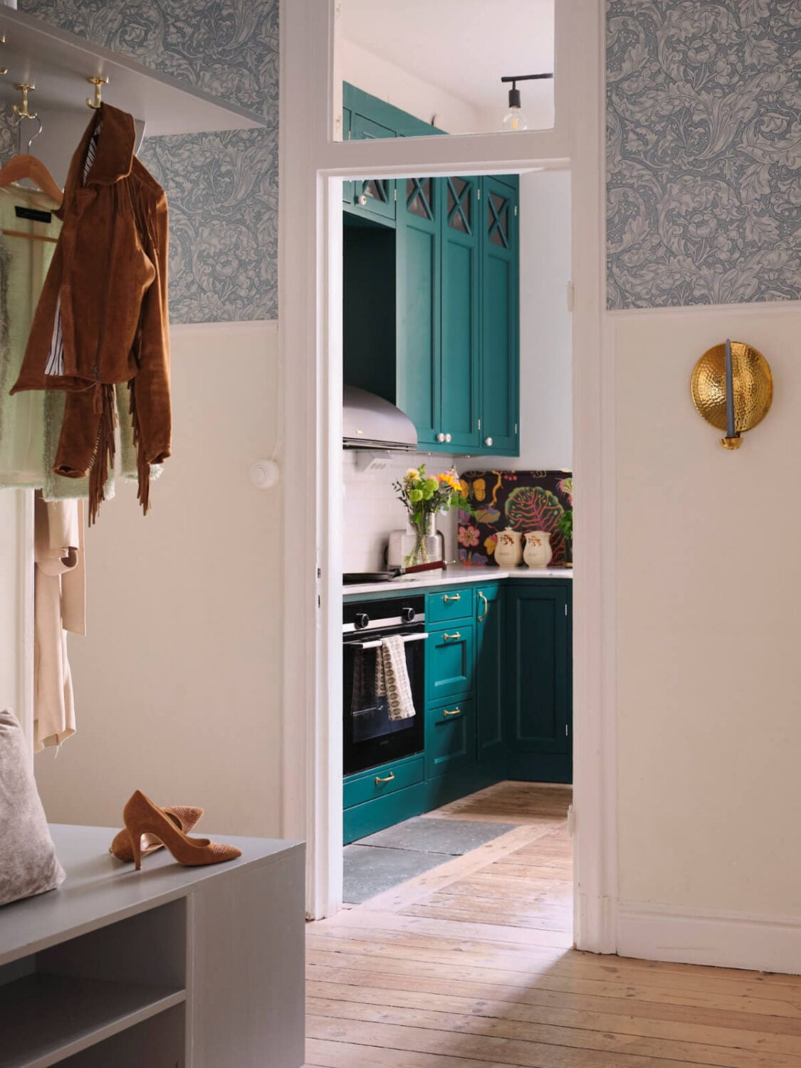 A Spacious Turn-of-the-Century Apartment with Nice Color Accents 31 view into kitchen