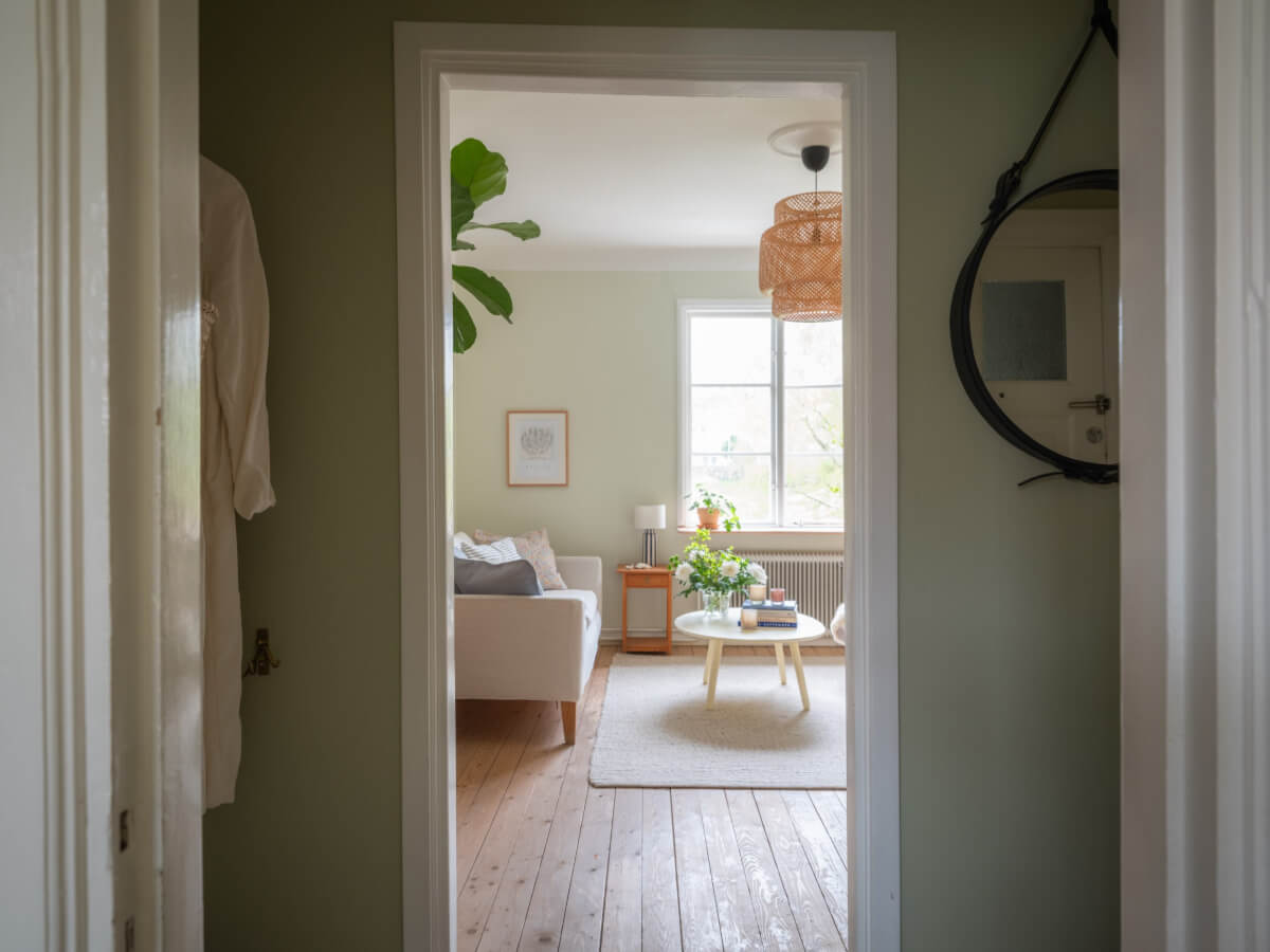 A Soft Color Palette and a Charming Kitchen in a Swedish Apartment 10 view into living room