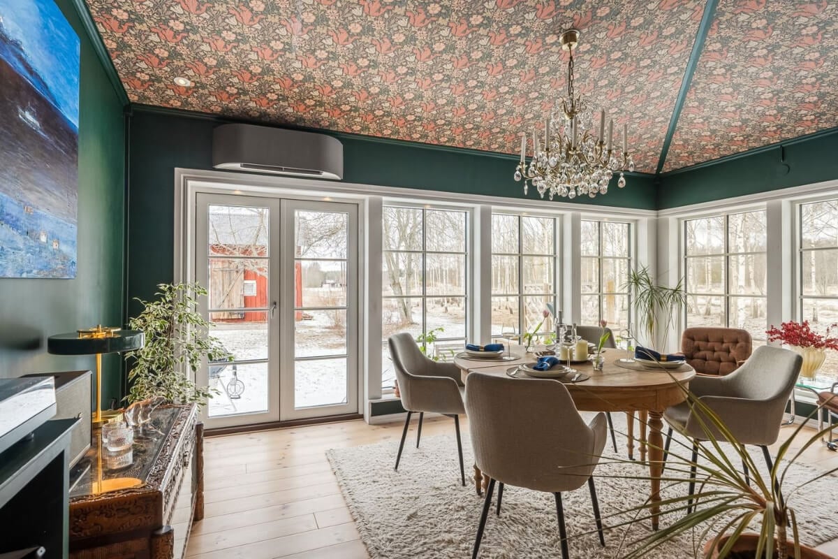 A Cozy Country House in Sweden Filled with Wallpapers 18 wallpapered ceiling garden room with round table