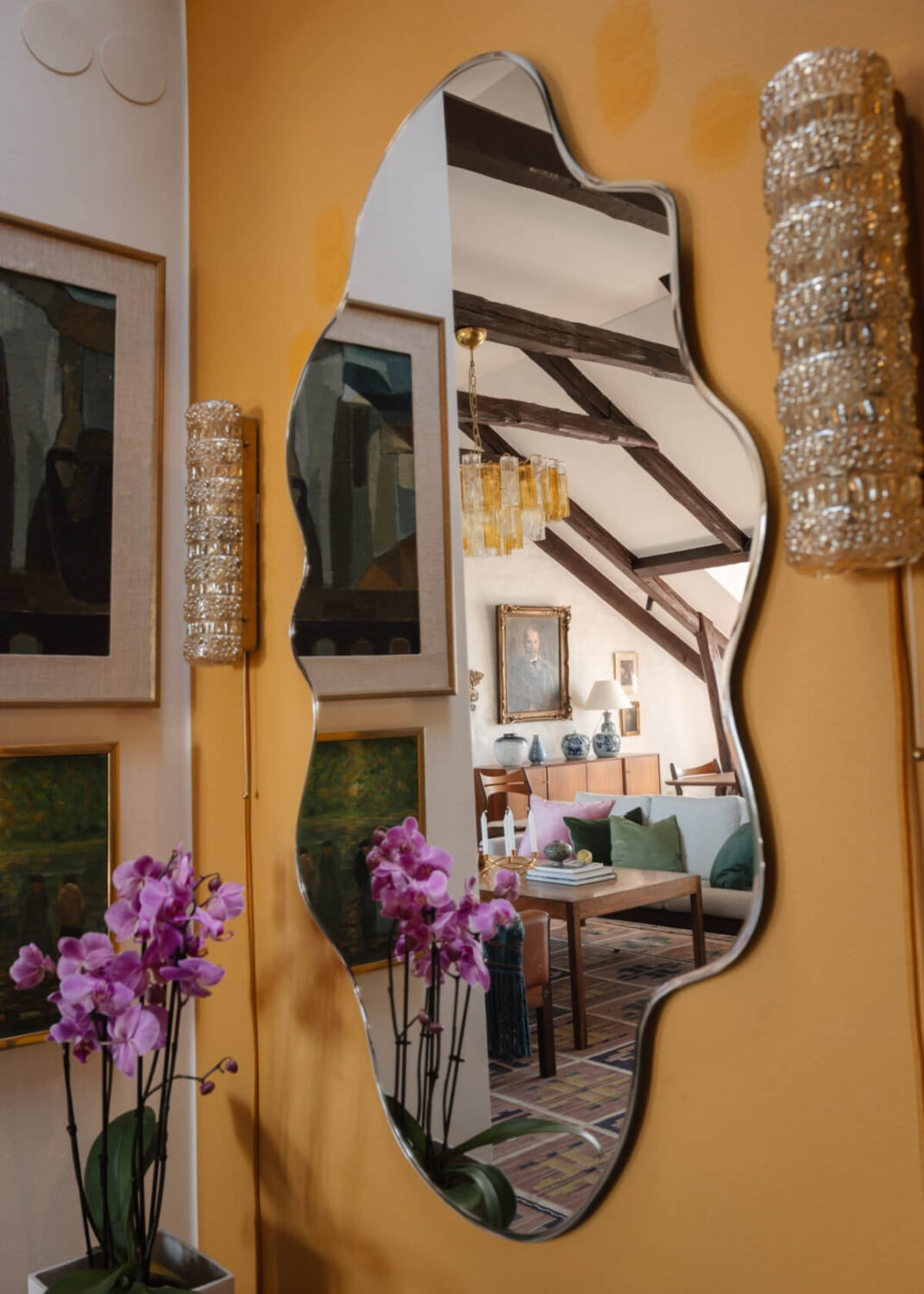 Revisiting a Spectacular Stockholm Penthouse with Exposed Beams 23 wavy mirror