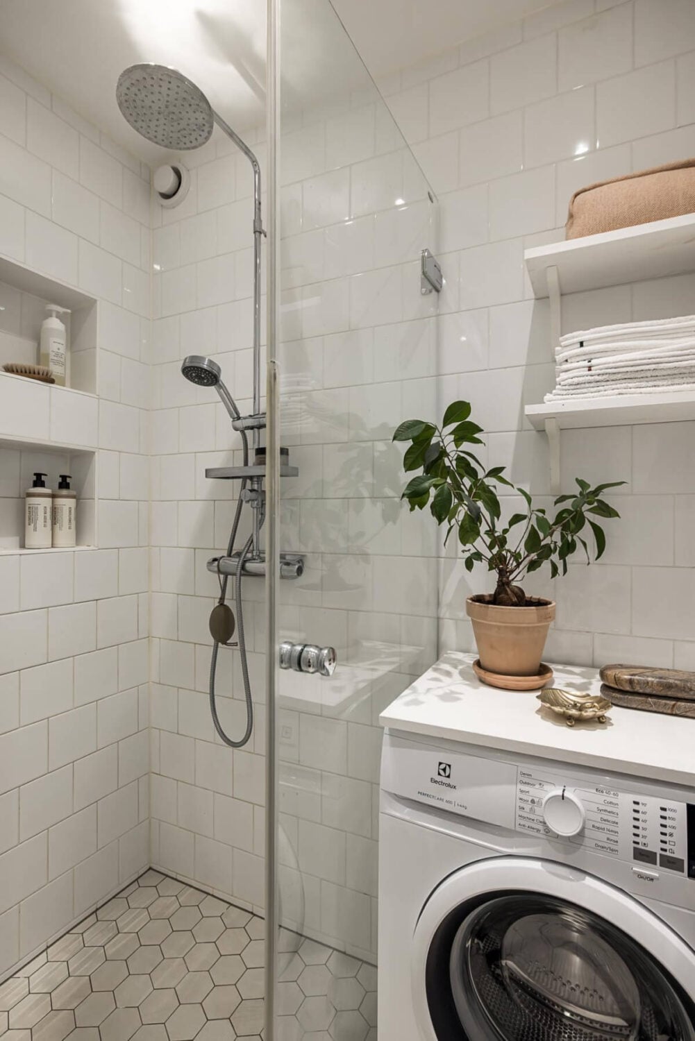 Gray Tones and a Classic Kitchen in a Swedish Apartment 25 white bathroom hexagon floor tiles