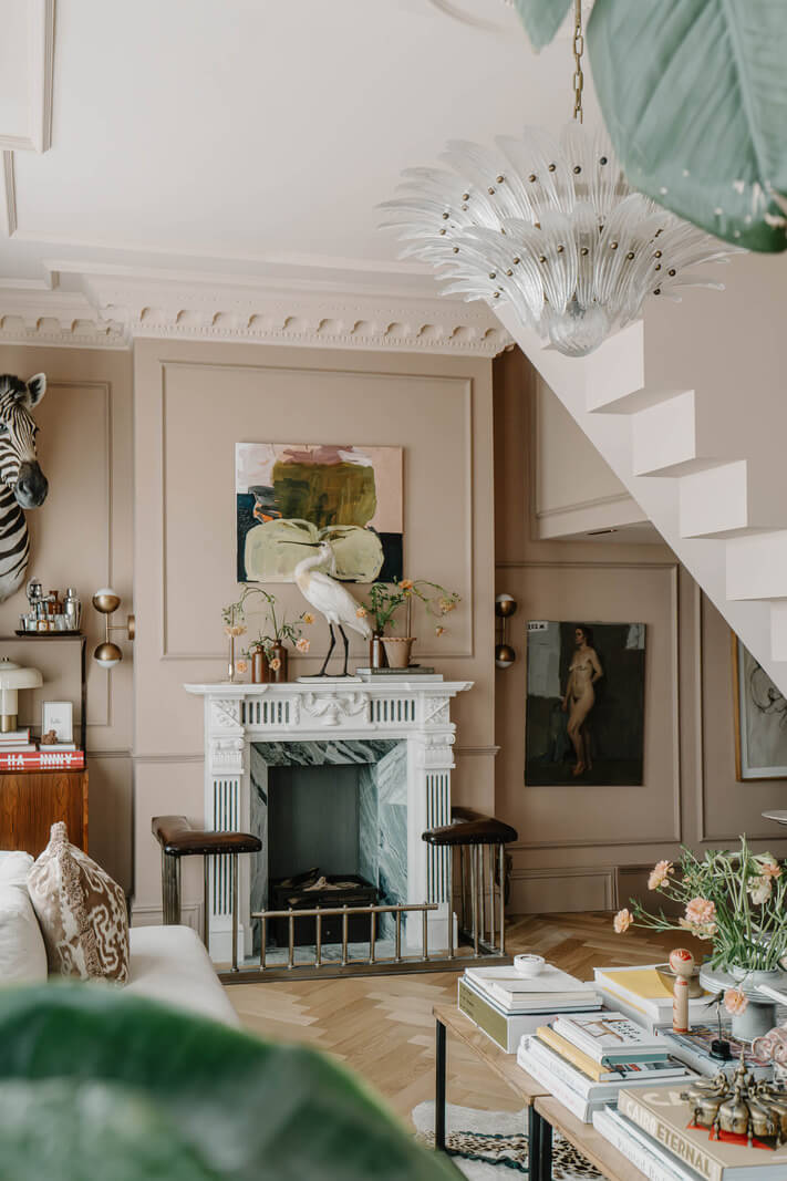 A Classy Apartment on the Top Floors of a 19th-Century Building 3 white fireplace mantel living room