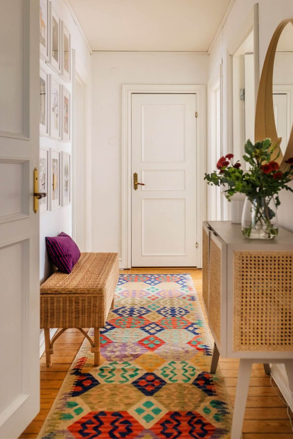 A Bright Family Apartment in Södermalm 23 white hall colorful rug