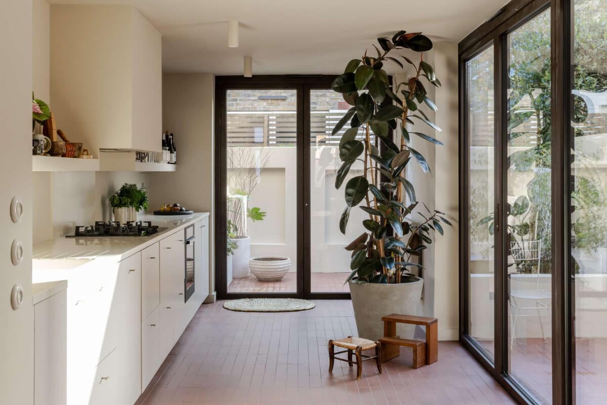 Natural Materials and Period Features in a Restored Victorian House 9 white kitchen terracotta floor tiles