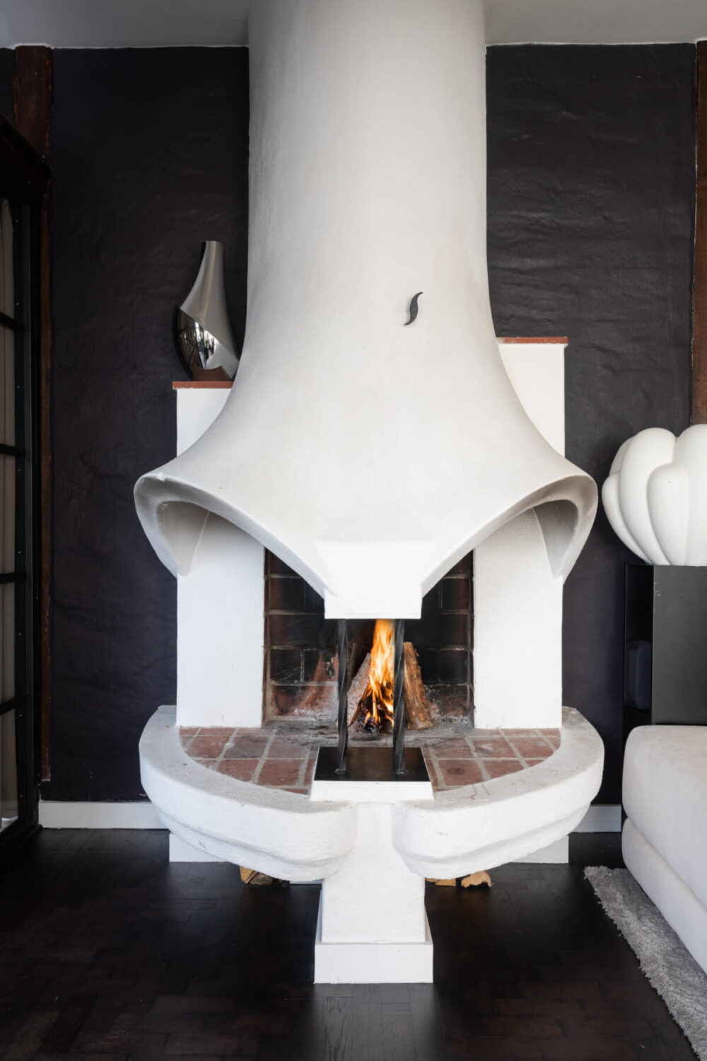A Stylish Black and White Penthouse Apartment in Stockholm 11 white sculptural fireplace penthouse apartment