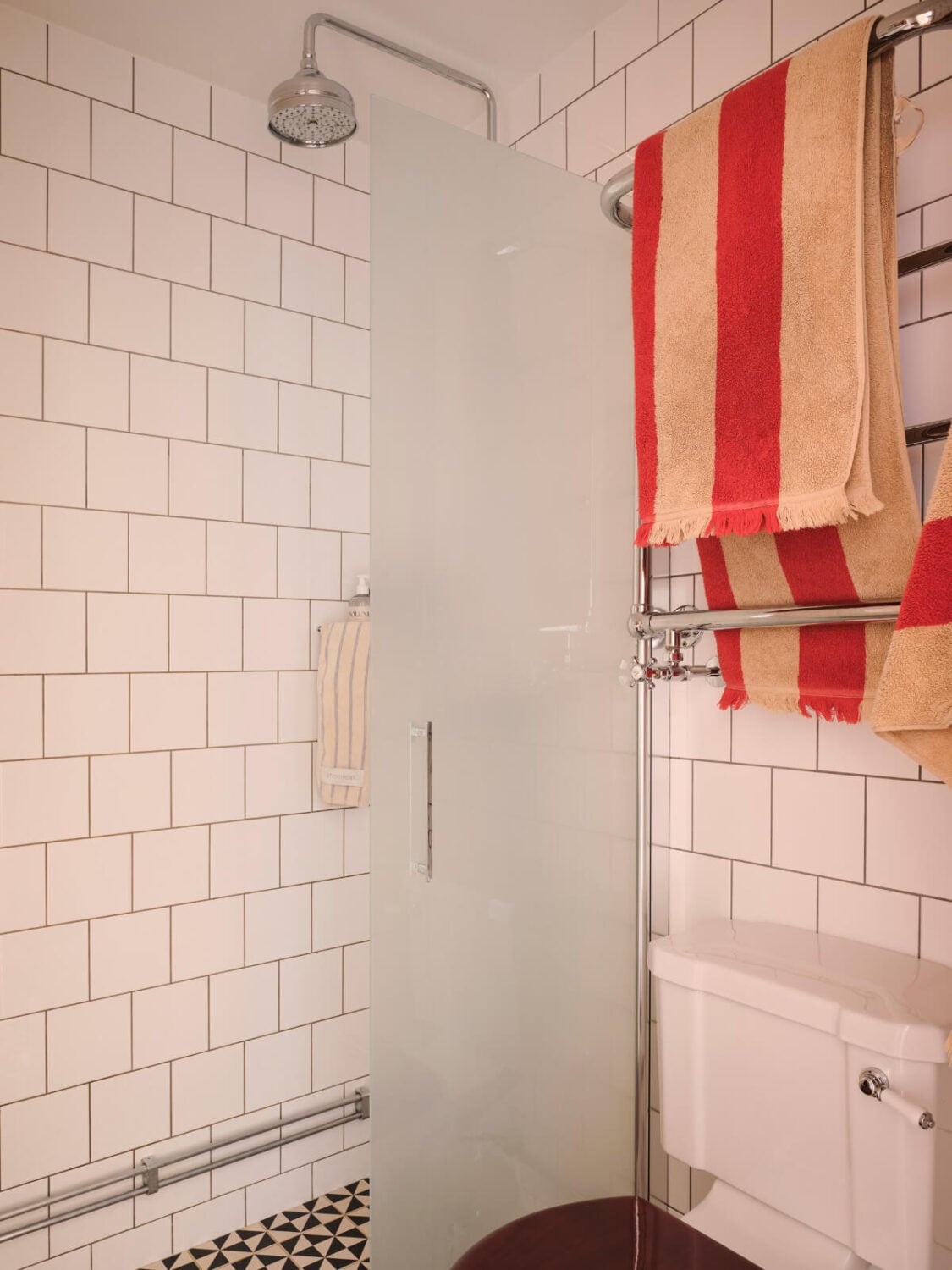 Warm, Natural Light in a Renovated Turn-of-the-Century Apartment 25 white tiles bathroom