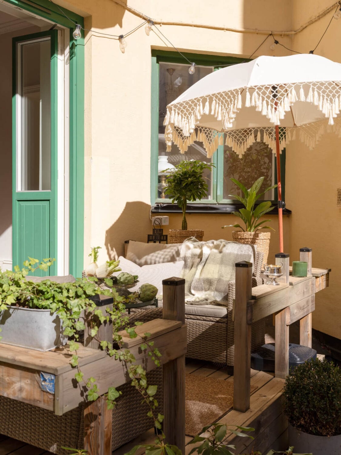 A Small Apartment with Green Color Accents and a Cozy Patio Terrace 9 wooden terrace