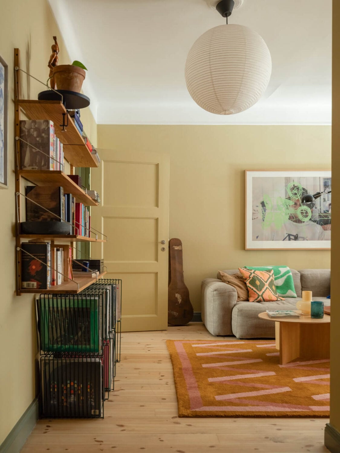 A Yellow and Green Color Palette in a Modern Swedish Apartment 6 yellow living room green woodwork wooden floor