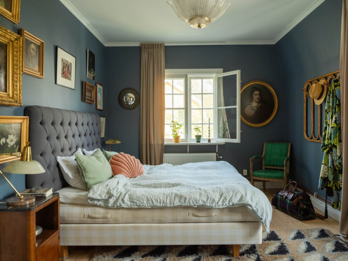 An Early 20th-Century Family Home Decorated with Color and Art 17 antique art blue walls bedroom