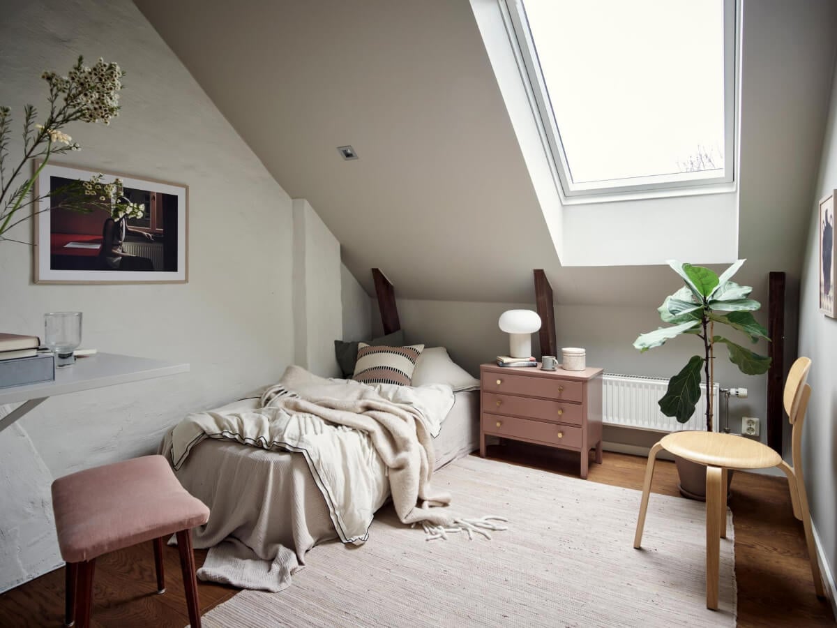 A Harmonious Color Palette in a Swedish Duplex Apartment 28 attic bedroom exposed wall