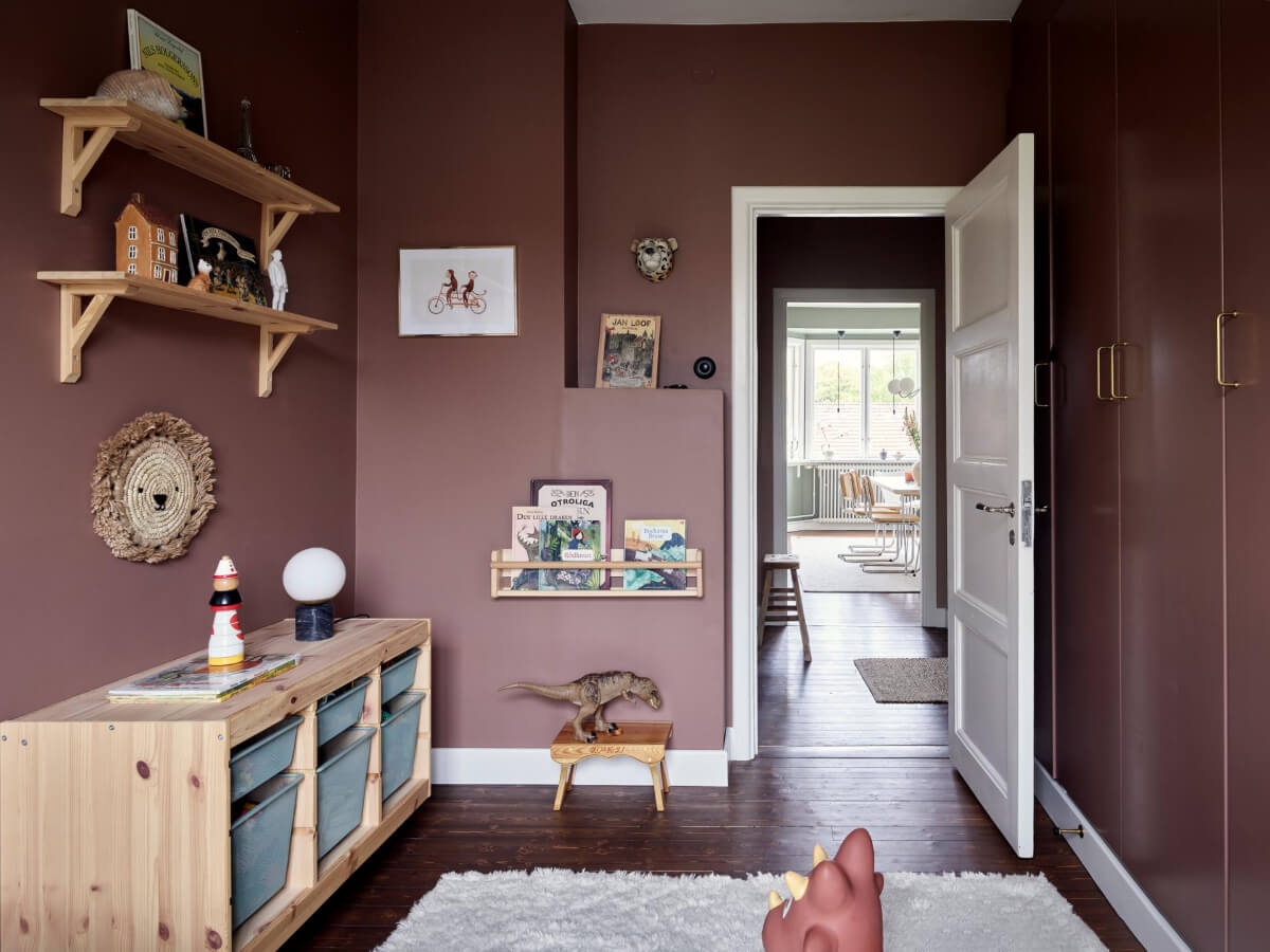 A Harmonious Color Palette in a Swedish Duplex Apartment 19 aubergine colored walls kids bedroom built in wardrobes
