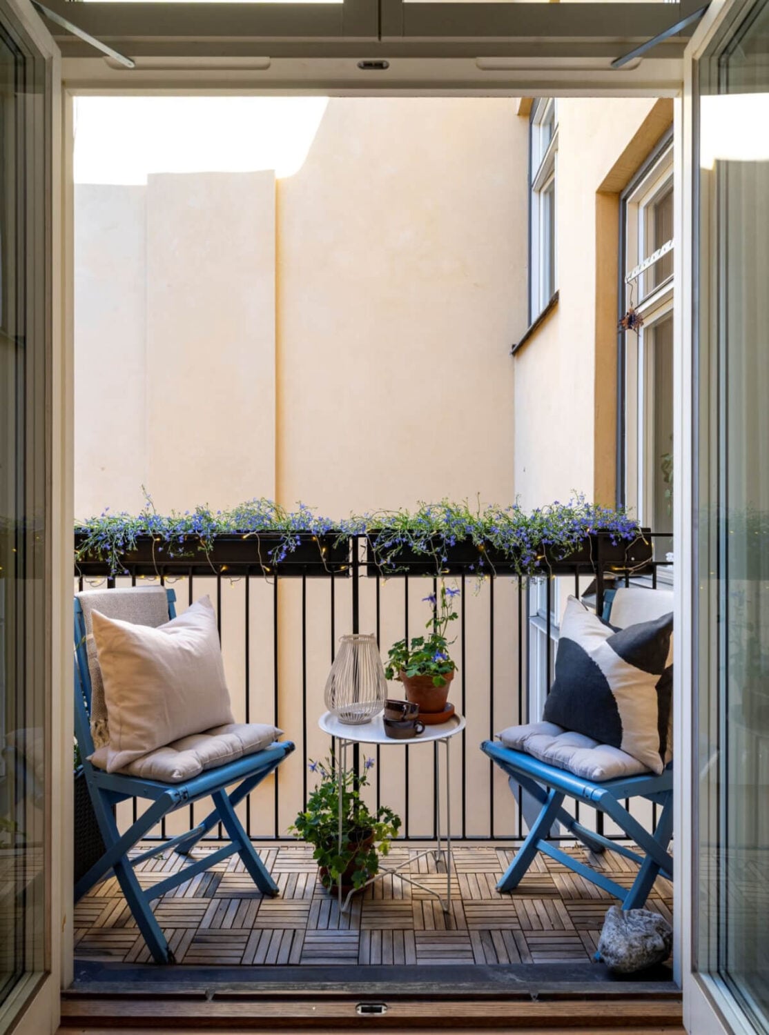 Wallpapers and Blue Tones in a Cozy Turn-of-the-Century Home 21 balcony blue chairs