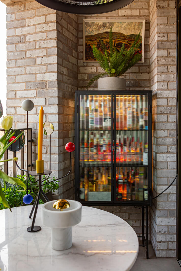 Playful Colors in a Modern One-Bedroom Apartment in London 14 balcony cabinet