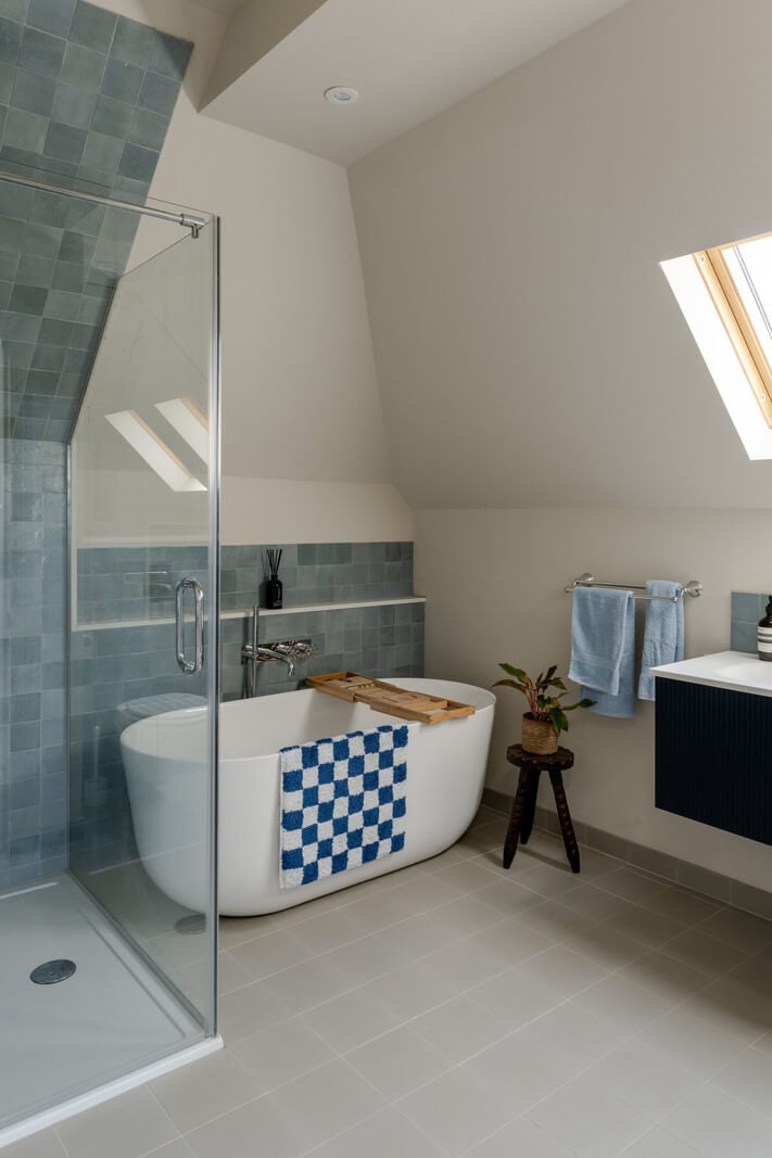 A Grand Edwardian Villa with a Yellow Kitchen and Coastal Views 28 bathroom blue tiles