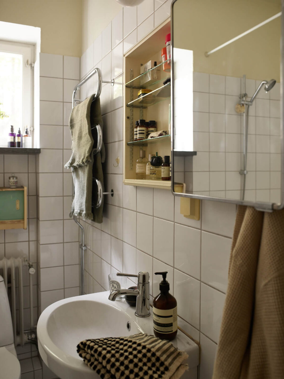 Wallpapers and a Midcentury-Style Kitchen in a 1930s Apartment 26 bathroom cabinet