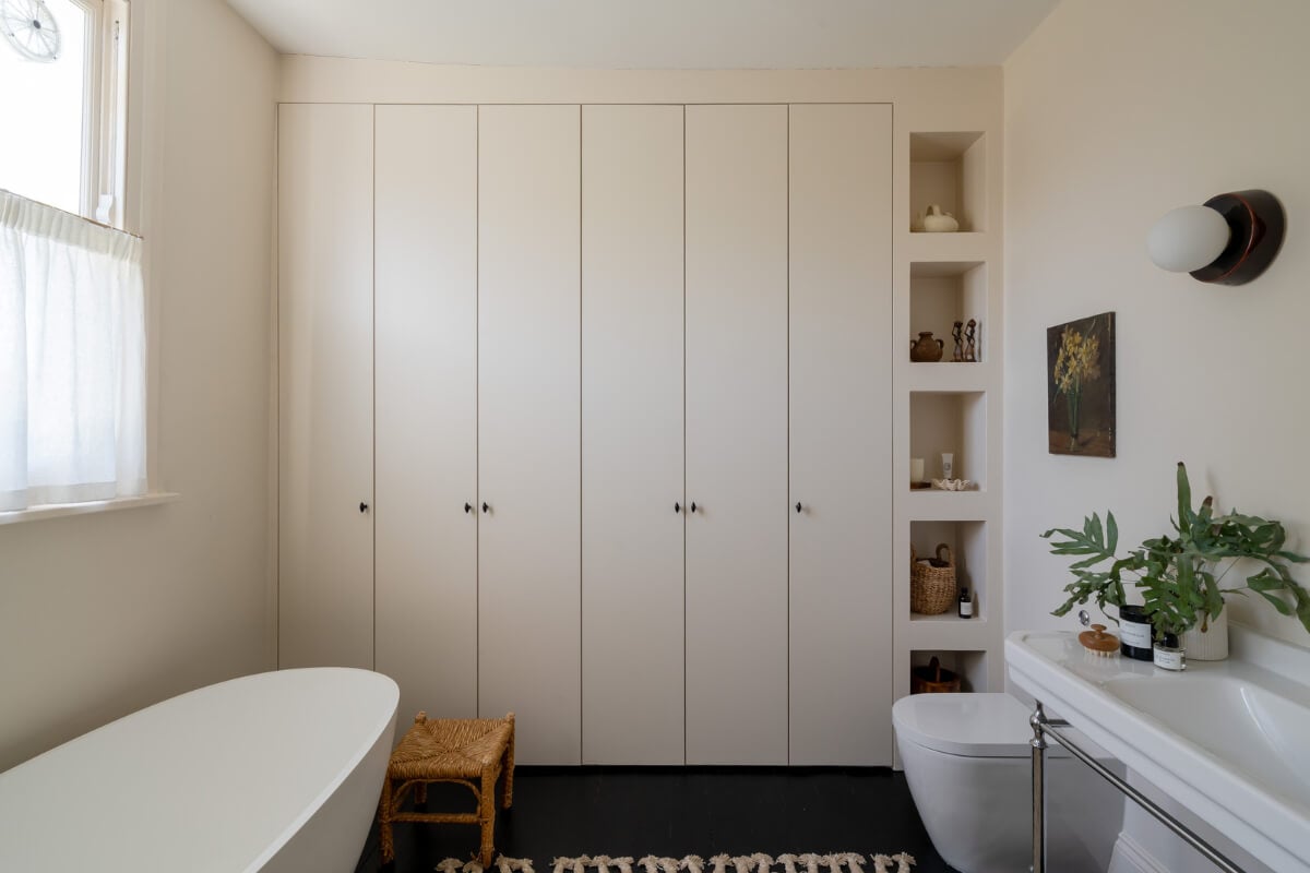 Contemporary and Classic Design in a Two-Bedroom London Duplex 18 bathroom freestanding lusso bath built-in cabinets and shelves
