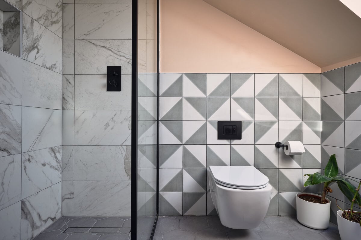 Moody Tones in a Restored and Extended Victorian Home in London 21 bathroom-geometric-tiles-pink-walls