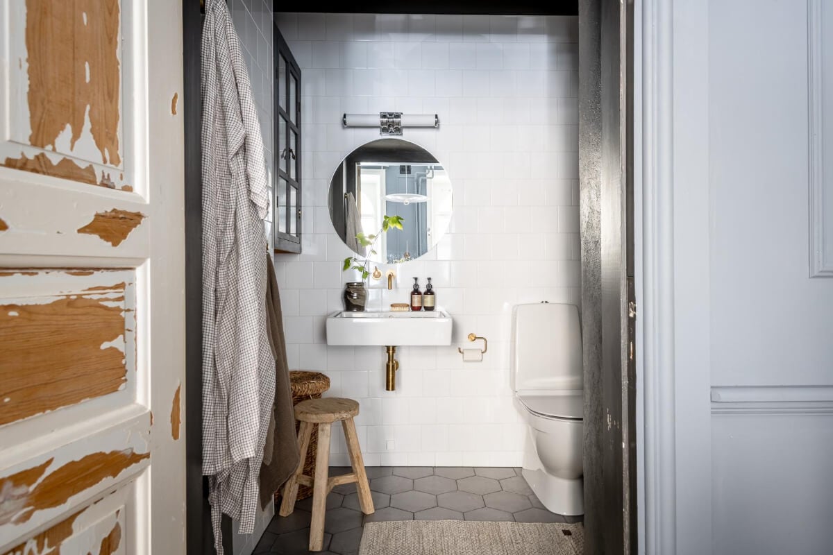 A Blue Studio Apartment with Unique Stucco and Site-Built Storage 16 bathroom hexagon floor tiles
